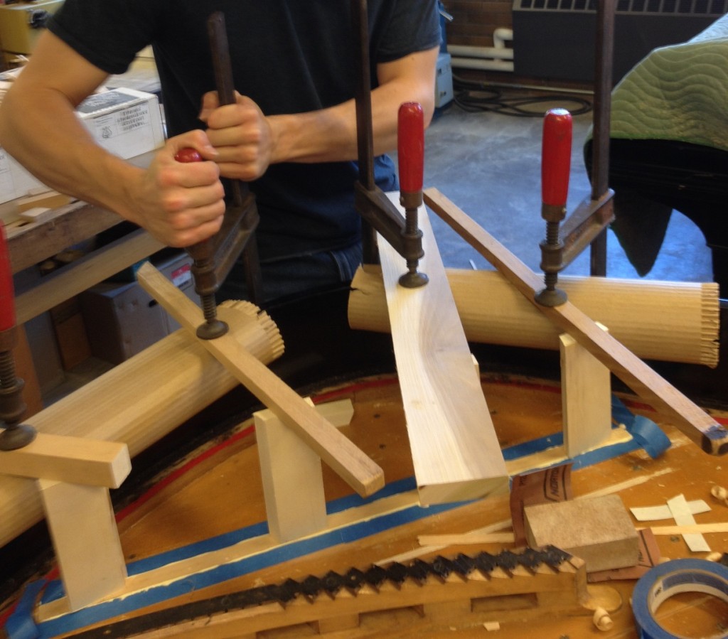 Applying wood clamps to press components for gluing